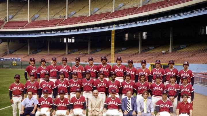CLEVELAND - 1977: Members of the Cleveland Indians pose for a team portrait prior to a game in 1977 at Municipal Stadium in Cleveland, Ohio. Those pictured include (L to R) (first row) clubhouse manager Cy Buynak, Dave Oliver, coach Harvey Haddix, coach Joe Nosek, general manager Phil Seghi, manager Jeff Torborg, president Ted Bonda, traveling secretary Mike Seghi, coach Rocky Colavito, trainer Jimmy Warfield; (second row) Larvell Blanks, Jim Norris, Paul Dade, John Lowenstein, Rick Waits, Don Hood, Pat Dobson, Rico Carty, Wayne Garland, Dennis Eckersley, Frank Duffy, Ron Pruitt, Duane Kuiper; (third row) Rick Manning, Bill Melton, Buddy Bell, Johnny Grubb, Tom Buskey, Bruce Bochte, Jim Bibby, Jim Kern, Andre Thornton, Ray Fosse, Al Fitzmorris, Sid Monge, Fred Kendall. Cleveland Indians7701 (Photo by: Ron Kuntz Collection/Diamond Images/Getty Images)