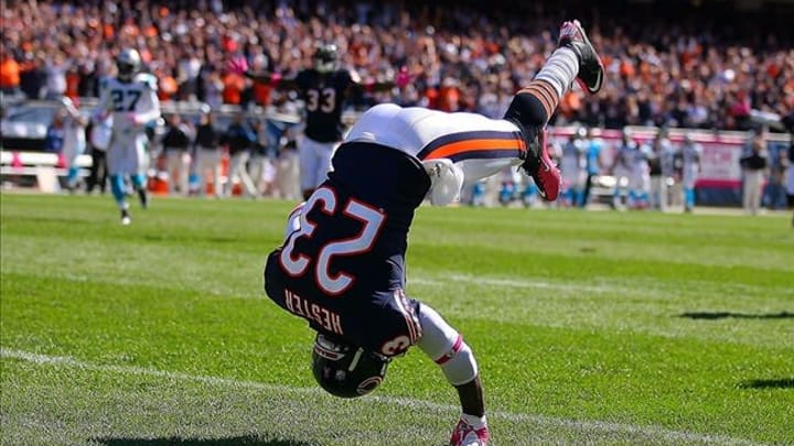Oct 2, 2011; Chicago, IL, USA; Chicago Bears wide receiver Devin Hester (23) celebrates his 69 yard punt return for a touchdown during the second quarter against the Carolina Panthers at Soldier Field. Mandatory Credit: Dennis Wierzbicki-US PRESSWIRE