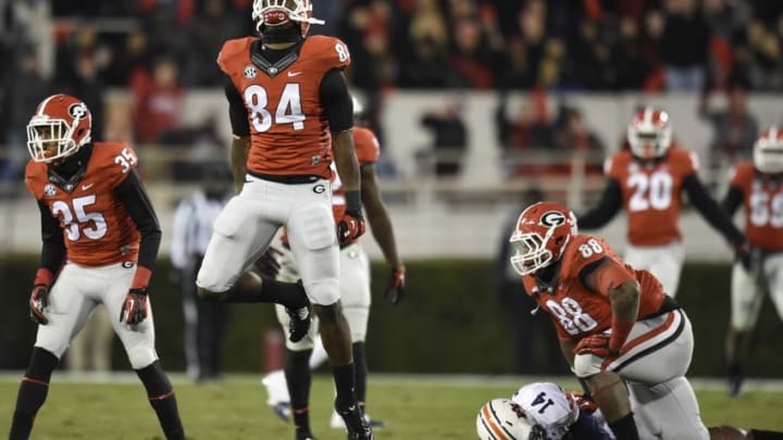 Nov 15, 2014; Athens, GA, USA; Georgia Bulldogs linebacker Leonard Floyd (84) reacts after sacking Auburn Tigers quarterback Nick Marshall (14) during the second half at Sanford Stadium. Georgia defeated Auburn 34-7. Mandatory Credit: Dale Zanine-USA TODAY Sports