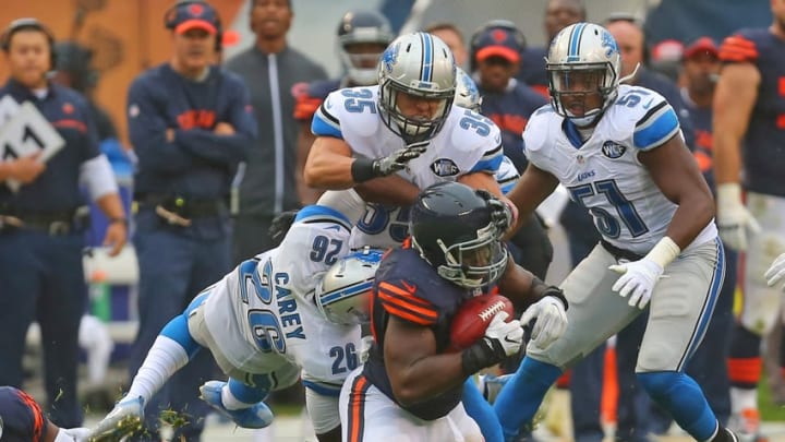 Oct 2, 2016; Chicago, IL, USA; Chicago Bears outside linebacker Sam Acho (49) recovers an onside kick with Detroit Lions strong safety Don Carey (26) and strong safety Miles Killebrew (35) in pursuit during the second half at Soldier Field. Chicago won 17-14. Mandatory Credit: Dennis Wierzbicki-USA TODAY Sports