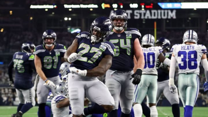 ARLINGTON, TEXAS - JANUARY 05: Mike Davis #27 of the Seattle Seahawks dances in the end zone after a touchdown to take the lead against the Dallas Cowboys in the third quarter during the Wild Card Round at AT&T Stadium on January 05, 2019 in Arlington, Texas. (Photo by Ronald Martinez/Getty Images)