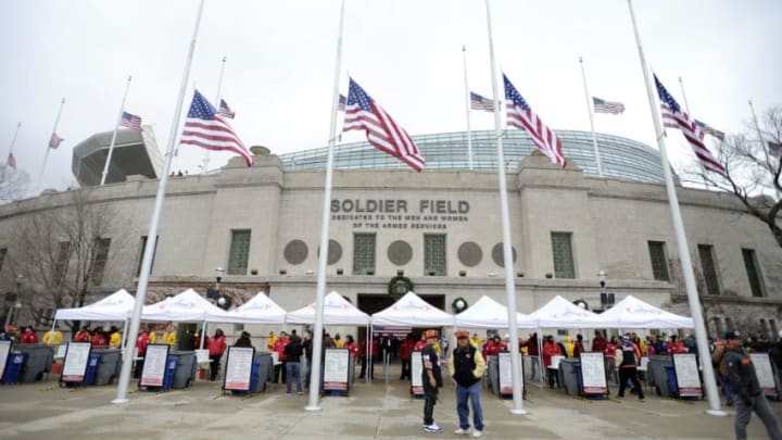 CHICAGO, IL - DECEMBER 16: American flags fly at half staff to honor the fallen victims of the Newtown, CT elementary school shooting massacre before the game between the Chicago Bears and the Green Bay Packers on December 16, 2012 at Soldier Field in Chicago, Illinois. (Photo by David Banks/Getty Images)