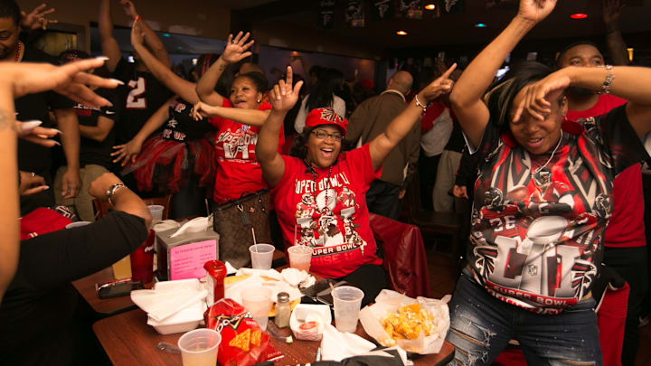 ATLANTA, GA – FEBRUARY 05: (L-R) Dililah Malone, Keesha Alexander and Yolanda Fuller celebrate a Falcons’ touchdown while watching Super Bowl 51 against the New England Patriots at Dugan’s bar on February 5, 2017 in Atlanta, Georgia. (Photo by Jessica McGowan/Getty Images)