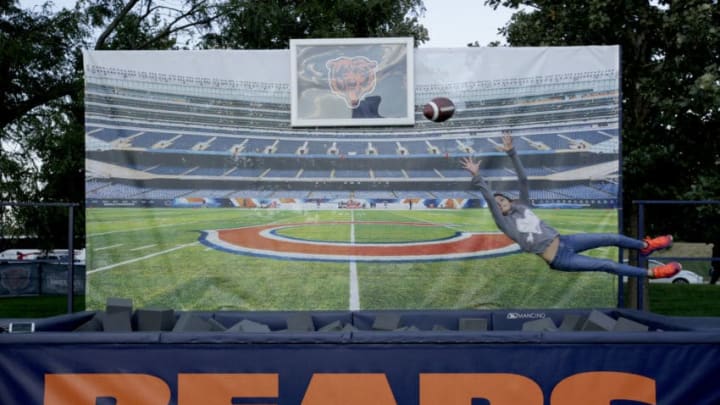 CHICAGO, IL - OCTOBER 09: A fan dives for the football outside of Soldier Field prior to the game between the Chicago Bears and the Minnesota Vikings on October 9, 2017 in Chicago, Illinois. (Photo by Kena Krutsinger/Getty Images)