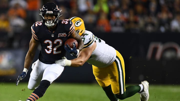 CHICAGO, ILLINOIS – SEPTEMBER 05: David Montgomery #32 of the Chicago Bears is brought down by Dean Lowry #94 of the Green Bay Packers during a game at Soldier Field on September 05, 2019 in Chicago, Illinois. (Photo by Stacy Revere/Getty Images)