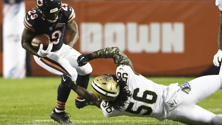 CHICAGO, ILLINOIS – OCTOBER 20: Demario Davis #56 of the New Orleans Saints tackles Tarik Cohen #29 of the Chicago Bears during the second half at Soldier Field on October 20, 2019 in Chicago, Illinois. The New Orleans Saints defeated the Chicago Bears 36-25. (Photo by David Banks/Getty Images)