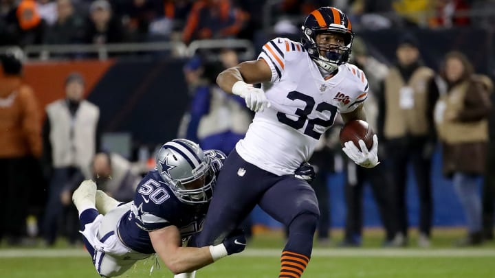 CHICAGO, ILLINOIS – DECEMBER 05: Running back David Montgomery #32 of the Chicago Bears carries against the defense of outside linebacker Sean Lee #50 of the Dallas Cowboys during the game at Soldier Field on December 05, 2019 in Chicago, Illinois. (Photo by Jonathan Daniel/Getty Images)