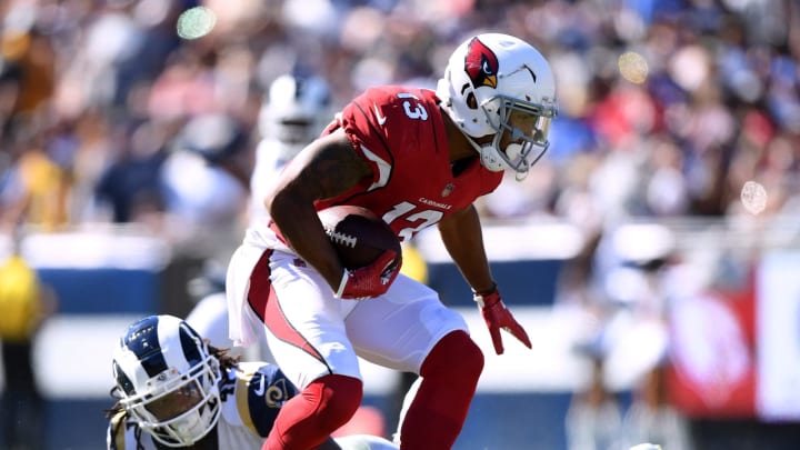 LOS ANGELES, CA – SEPTEMBER 16: Christian Kirk #13 of the Arizona Cardinals takes a hit from Marqui Christian #41 of the Los Angeles Rams during the fourth quarter at Los Angeles Memorial Coliseum on September 16, 2018 in Los Angeles, California. (Photo by Harry How/Getty Images)