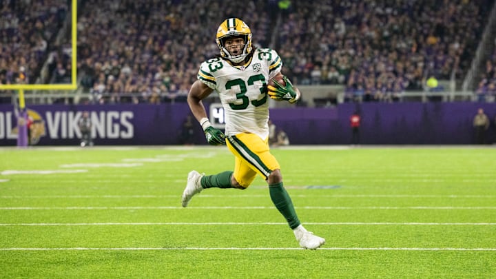 MINNEAPOLIS, MN – NOVEMBER 25: Aaron Jones #33 of the Green Bay Packers runs with the ball for a six-yard touchdown in the second quarter of the game against the Minnesota Vikings at U.S. Bank Stadium on November 25, 2018 in Minneapolis, Minnesota. (Photo by Adam Bettcher/Getty Images)