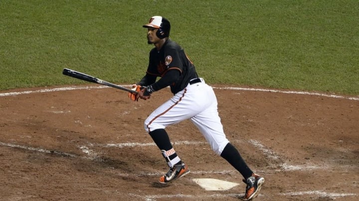 Jun 24, 2016; Baltimore, MD, USA; Baltimore Orioles center fielder Adam Jones (10) hits a solo home run during the sixth inning against the Tampa Bay Rays at Oriole Park at Camden Yards. Baltimore Orioles defeated Tampa Bay Rays 6-3. Mandatory Credit: Tommy Gilligan-USA TODAY Sports