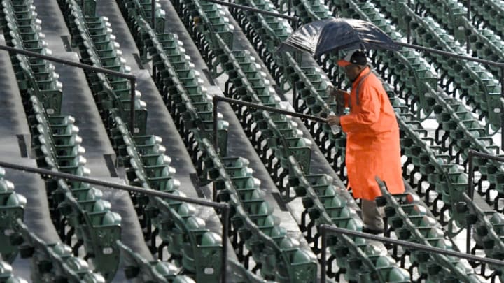BALTIMORE, MD - SEPTEMBER 27: A security guard walks up the stairs after the baseball game between the Houston Astros and the Baltimore Orioles is canceled at Oriole Park at Camden Yards on September 27, 2018 in Baltimore, Maryland. (Photo by Mitchell Layton/Getty Images)