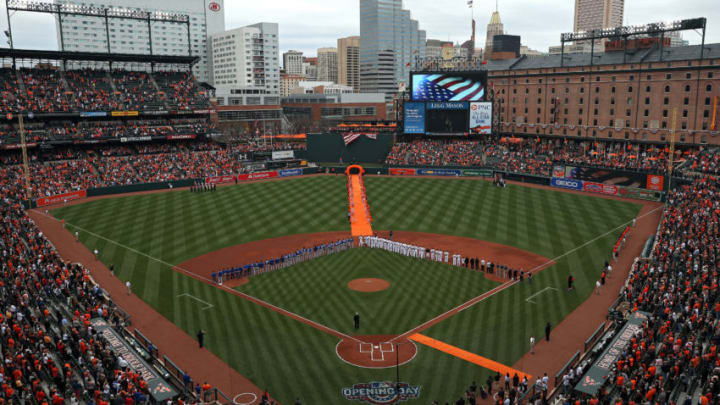 BALTIMORE, MD - APRIL 03: The Baltimore Orioles and the Toronto Blue Jays stand during the national anthem before their Opening Day game at Oriole Park at Camden Yards on April 3, 2017 in Baltimore, Maryland (Photo by Patrick Smith/Getty Images)