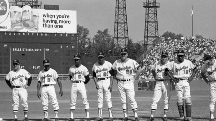 BALTIMORE, MD - OCTOBER 11, 1969: Members of the Baltimore Orioles line up along the thirdbase line prior to the start of Game 1 of the World Series on October 11, 1969 against the New York Mets at Memorial Stadium in Baltimore, Maryland. Those pictured include (L to R): manager Earl Weaver #4, outfielder Don Buford #9, outfielder Paul Blair #6, outfielder Frank Robinson #20; first baseman Boog Powell, thirdbaseman Brooks Robinson #5, catcher Elrod Hendricks #10 and second baseman Davey Johnson #15. (Photo by: Kidwiler Collection/Diamond Images/Getty Images)