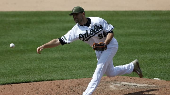 BALTIMORE, MD - MAY 29: Darren O'Day #56 of the Baltimore Orioles pitches against the New York Yankees during the eighth inning at Oriole Park at Camden Yards on May 29, 2017 in Baltimore, Maryland. MLB players across the league are wearing special uniforms to commemorate Memorial Day. (Photo by Matt Hazlett/Getty Images)