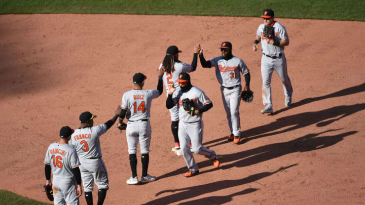 Apr 4, 2021; Boston, Massachusetts, USA; The Baltimore Orioles celebrate their win over the Boston Red Sox at Fenway Park. Mandatory Credit: Bob DeChiara-USA TODAY Sports