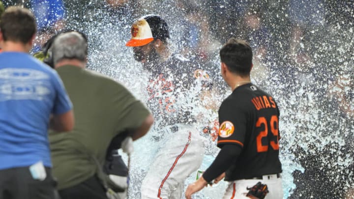 May 20, 2022; Baltimore, Maryland, USA; Baltimore Orioles second baseman Rougned Odor (12) is doused with Gatorade after hitting a walk-off two-run home run during the thirteenth inning at Oriole Park against the Tampa Bay Rays at Camden Yards. Mandatory Credit: Gregory Fisher-USA TODAY Sports