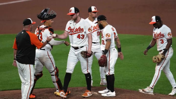 Aug 24, 2022; Baltimore, Maryland, USA; Baltimore Orioles manager Brandon Hyde (18) removes pitcher Bryan Baker (43) from the game in the seventh inning against the Chicago White Sox at Oriole Park at Camden Yards. Mandatory Credit: Mitch Stringer-USA TODAY Sports