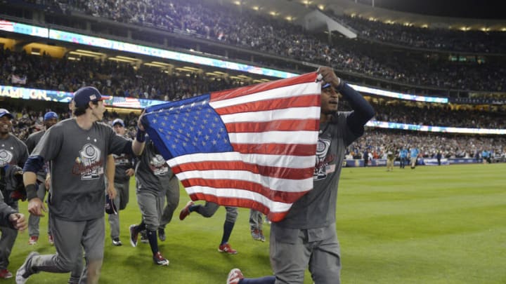 Mar 22, 2017; Los Angeles, CA, USA; USA outfielder Christian Yelich (7) and outfielder Adam Jones (10) celebrate the 8-0 victory against Puerto Rico following the 2017 World Baseball Classic at Dodger Stadium. Mandatory Credit: Gary A. Vasquez-USA TODAY Sports