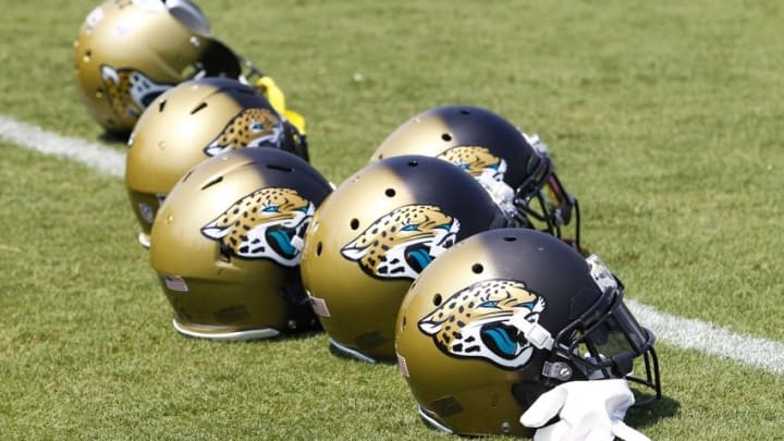 Jun 14, 2016; Jacksonville, FL, USA; Jacksonville Jaguars player helmets rest on the sideline during minicamp workouts at Florida Blue Health and Wellness Practice Fields. Mandatory Credit: Logan Bowles-USA TODAY Sports