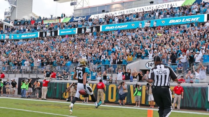 Dec 13, 2015; Jacksonville, FL, USA; Jacksonville Jaguars wide receiver Rashad Greene (13) returns a punt for a touchdown against the Indianapolis Colts in the third quarter at EverBank Field. The Jaguars won 51-16. Mandatory Credit: Jim Steve-USA TODAY Sports