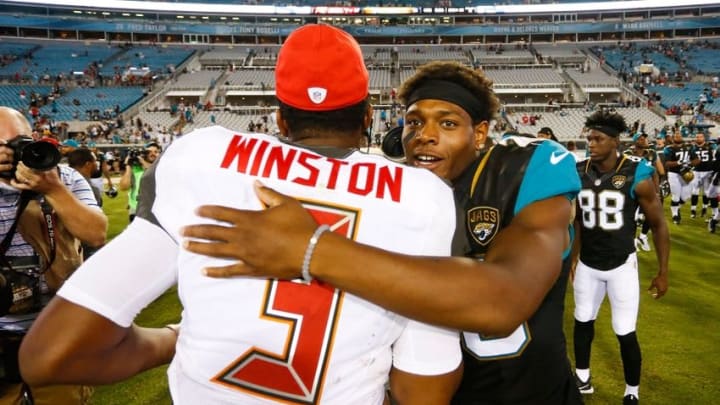 Aug 20, 2016; Jacksonville, FL, USA; Tampa Bay Buccaneers quarterback Jameis Winston (3) and Jacksonville Jaguars cornerback Jalen Ramsey (20) embrace after a game at EverBank Field. The Tampa Bay Buccaneers won 27-21. Mandatory Credit: Logan Bowles-USA TODAY Sports