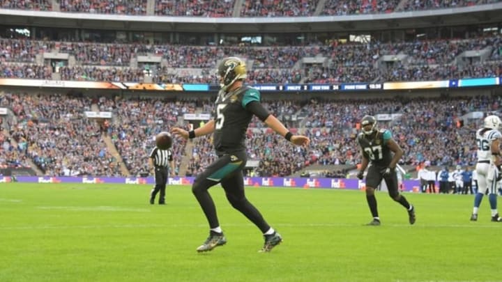 Oct 2, 2016; London, United Kingdom; Jacksonville Jaguars quarterback Blake Bortles (5) kicks the ball into the crowd after scoring on a 1-yard touchdown run in the second quarter against the Indianapolis Colts during game 15 of the NFL International Series at Wembley Stadium. Mandatory Credit: Kirby Lee-USA TODAY Sports