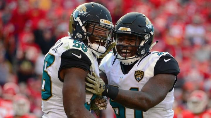 Nov 6, 2016; Kansas City, MO, USA; Jacksonville Jaguars defensive end Yannick Ngakoue (91) celebrates with defensive end Dante Fowler (56) after sacking Kansas City Chiefs quarterback Nick Foles (not pictured) during the second half at Arrowhead Stadium. The Chiefs won 19-14. Mandatory Credit: Jeff Curry-USA TODAY Sports