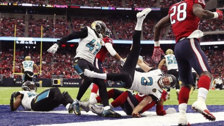 Dec 18, 2016; Houston, TX, USA; Jacksonville Jaguars punter Brad Nortman (3) is upended during the first half against the Houston Texans at NRG Stadium. Mandatory Credit: Kevin Jairaj-USA TODAY Sports