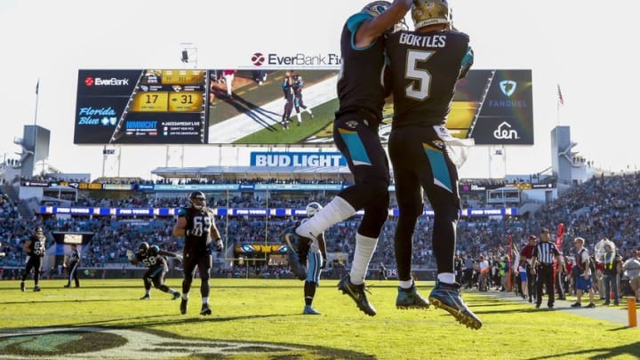 Dec 24, 2016; Jacksonville, FL, USA; Jacksonville Jaguars quarterback Blake Bortles (5) celebrates after scoring a touchdown with Jacksonville Jaguars wide receiver Allen Robinson (15) in the second half against the Tennessee Titans at EverBank Field. The Jacksonville Jaguars won 38-17. Mandatory Credit: Logan Bowles-USA TODAY Sports