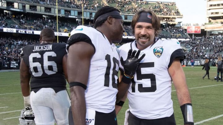 OAKLAND, CA - DECEMBER 15: Quarterback Gardner Minshew II #15 of the Jacksonville Jaguars celebrates with wide receiver Chris Conley #18 after the game against the Oakland Raiders at RingCentral Coliseum on December 15, 2019 in Oakland, California. The Jacksonville Jaguars defeated the Oakland Raiders 20-16. (Photo by Jason O. Watson/Getty Images)