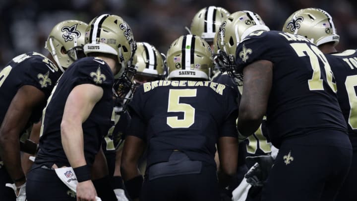 NEW ORLEANS, LOUISIANA - DECEMBER 30: Teddy Bridgewater #5 of the New Orleans Saints calls a play in the huddle during the first half against the Carolina Panthers at the Mercedes-Benz Superdome on December 30, 2018 in New Orleans, Louisiana. (Photo by Chris Graythen/Getty Images)