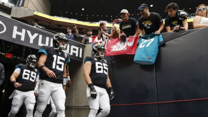 HOUSTON, TX - SEPTEMBER 15: Gardner Minshew #15 of the Jacksonville Jaguars and Brandon Linder #65 walk out of the tunnel before the game against the Houston Texans at NRG Stadium on September 15, 2019 in Houston, Texas. (Photo by Tim Warner/Getty Images)