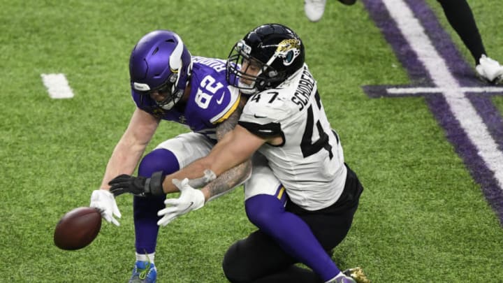 Kyle Rudolph #82 of the Minnesota Vikings and Joe Schobert #47 of the Jacksonville Jaguars (Photo by Hannah Foslien/Getty Images)