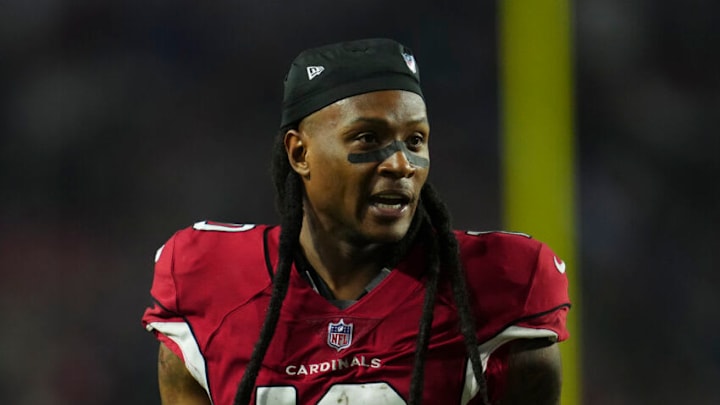 GLENDALE, AZ - DECEMBER 12: DeAndre Hopkins #10 of the Arizona Cardinals runs off of the field against the New England Patriots at State Farm Stadium on December 12, 2022 in Glendale, Arizona. (Photo by Cooper Neill/Getty Images) GLENDALE, AZ - DECEMBER 12: DeAndre Hopkins #10 of the Arizona Cardinals runs off of the field against the New England Patriots at State Farm Stadium on December 12, 2022 in Glendale, Arizona. (Photo by Cooper Neill/Getty Images)