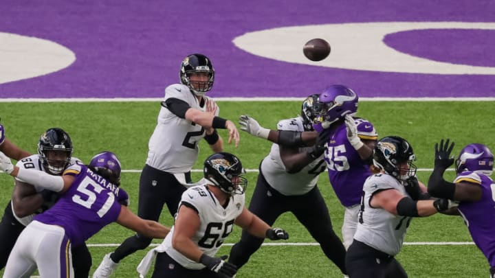 Dec 6, 2020; Minneapolis, Minnesota, USA; Jacksonville Jaguars quarterback Mike Glennon (2) passes in the fourth quarter against the Minnesota Vikings at U.S. Bank Stadium. Mandatory Credit: Brad Rempel-USA TODAY Sports