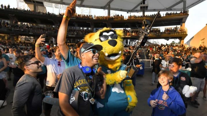 Jacksonville Jaguars mascot Jaxson de Ville uses his high-tech selfie stick to shoot video for the 2022 NFL Draft party. [Bob Self/Florida Times-Union]
