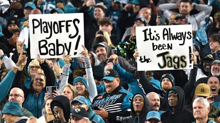 Jaguars fans hold their signs of support in the stands during the closing minutes of Saturday night's victory over the Tennessee Titans. The Jacksonville Jaguars hosted the Tennessee Titans to decide the AFC South championship at TIAA Bank Field in Jacksonville, FL, Saturday, January 7, 2023. The Jaguars went into the half trailing 7 to 13 but came back to win with a final score of 20 to 16. [Bob Self/Florida Times-Union]Jki 010723 Bs Jaguars Vs T 14