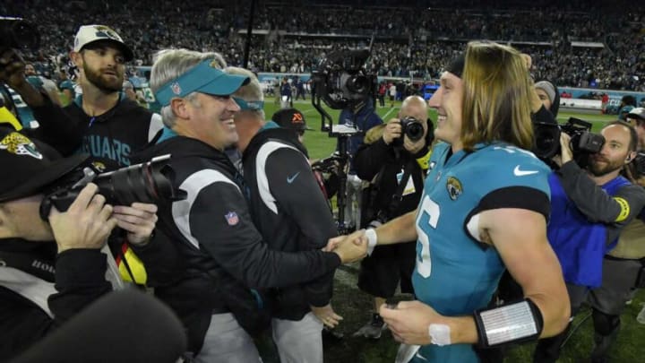 Jaguars head coach Doug Pederson and quarterback Trevor Lawrence greet each other after their win over the Tennessee Titans clinched the AFC South title, Saturday, Jan. 7, 2023, in Jacksonville.Jki 010723 Bs Jaguars Vs T 9