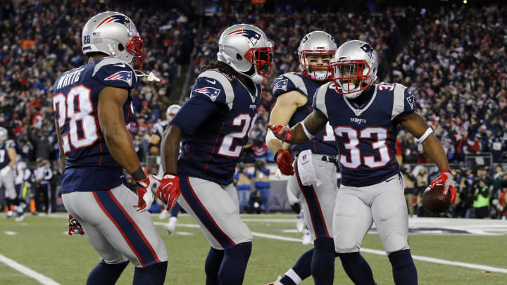 Jan 14, 2017; Foxborough, MA, USA; New England Patriots running back Dion Lewis (33) celebrates with teammates after scoring a touchdown against the Houston Texans during the first quarter in the AFC Divisional playoff game at Gillette Stadium. Mandatory Credit: David Butler III-USA TODAY Sports