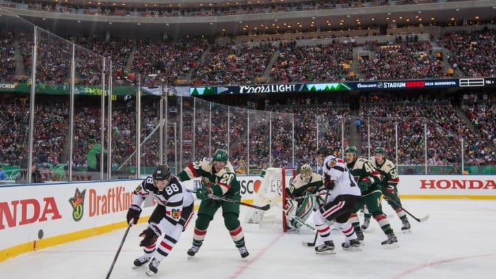 Feb 21, 2016; Minneapolis, MN, USA; Chicago Blackhawks forward Patrick Kane (88) protects the puck from Minnesota Wild defenseman Ryan Suter (20) during a Stadium Series hockey game at TCF Bank Stadium. The Minnesota Wild defeated the Chicago Blackhawks 6-1. Mandatory Credit: Brace Hemmelgarn-USA TODAY Sports