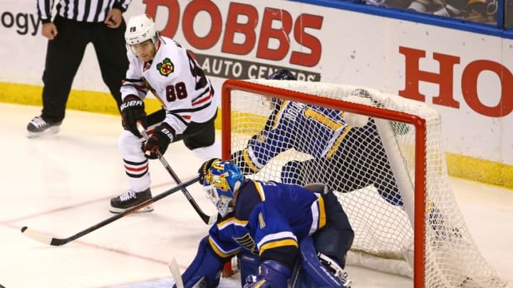 Apr 21, 2016; St. Louis, MO, USA; Chicago Blackhawks right wing Patrick Kane (88) wraps a shot around the back of the net against St. Louis Blues goalie Brian Elliott (1) during the second overtime period in game five of the first round of the 2016 Stanley Cup Playoffs at Scottrade Center. The Blackhawks won the game 4-3 in double overtime. Mandatory Credit: Billy Hurst-USA TODAY Sports Apr 21, 2016; St. Louis, MO, USA; Chicago Blackhawks right wing Patrick Kane (88) wraps a shot around the back of the net against St. Louis Blues goalie Brian Elliott (1) during the second overtime period in game five of the first round of the 2016 Stanley Cup Playoffs at Scottrade Center. The Blackhawks won the game 4-3 in double overtime. Mandatory Credit: Billy Hurst-USA TODAY Sports