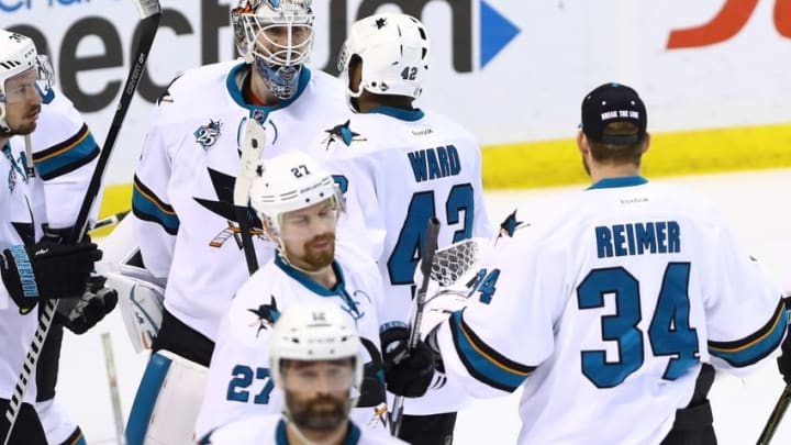 May 23, 2016; St. Louis, MO, USA; San Jose Sharks goalie Martin Jones (31) is congratulated by teammates after defeating the St. Louis Blues in game five of the Western Conference Final of the 2016 Stanley Cup Playoffs at Scottrade Center. The Sharks won the game 6-3. Mandatory Credit: Billy Hurst-USA TODAY Sports