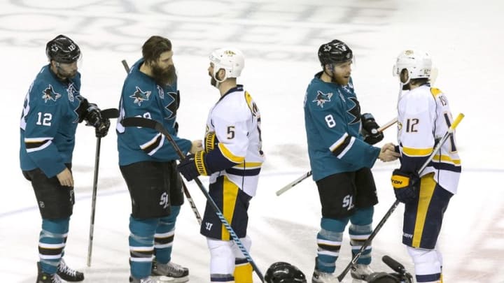 May 12, 2016; San Jose, CA, USA; San Jose Sharks center Joe Pavelski (8) and defenseman Brent Burns (88) and center Patrick Marleau (12) shake hands with Nashville Predators center Mike Fisher (12) and defenseman Barret Jackman (5) after the end of the game seven of the second round of the 2016 Stanley Cup Playoffs at SAP Center at San Jose. San Jose defeated Nashville 5-0. Mandatory Credit: Neville E. Guard-USA TODAY Sports