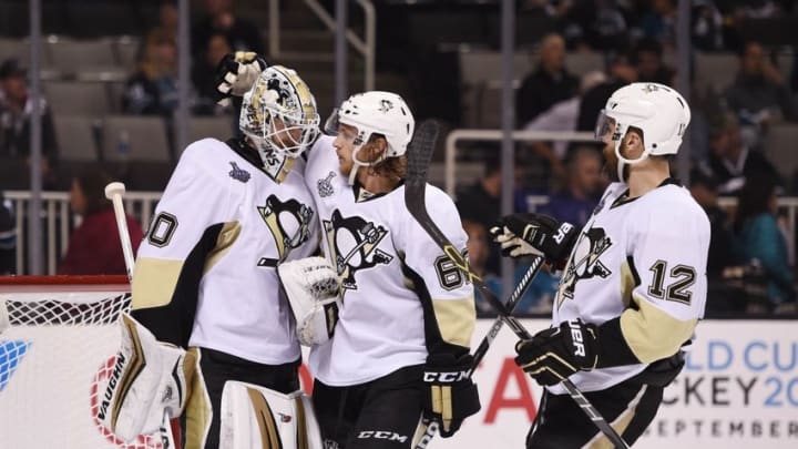 Jun 6, 2016; San Jose, CA, USA; Pittsburgh Penguins goalie Matt Murray (30) celebrates with left wing Carl Hagelin (62) and defenseman Ben Lovejoy (12) after defeating the San Jose Sharks in game four of the 2016 Stanley Cup Final at SAP Center at San Jose. Mandatory Credit: Kyle Terada-USA TODAY Sports