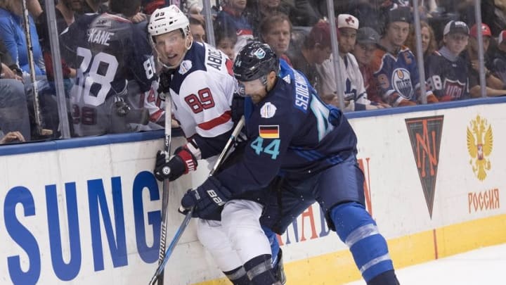 Sep 17, 2016; Toronto, Ontario, Team USA forward Justin Abdelkader (89) battles for a puck with Team Europe defenseman Dennis Seidenberg (44) during the third period of the preliminary round play in the 2016 World Cup of Hockey at Air Canada Centre. Team Europe won 3-0. Mandatory Credit: Nick Turchiaro-USA TODAY Sports