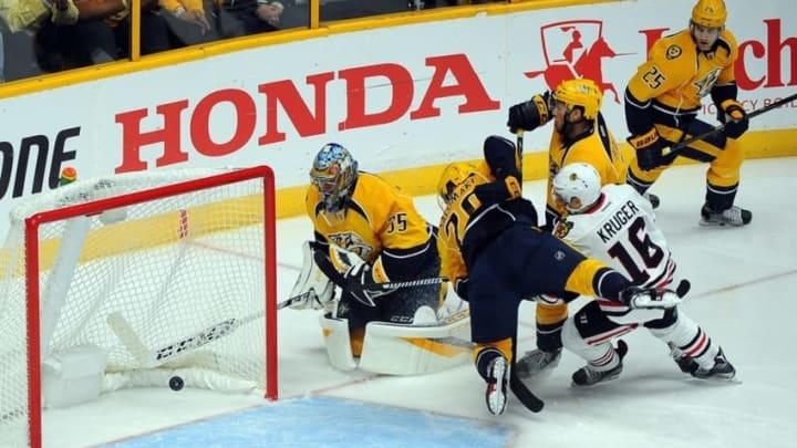 Oct 14, 2016; Nashville, TN, USA; Chicago Blackhawks center Marcus Kruger (16) scores a goal against Nashville Predators goalie Pekka Rinne (35) during the first period at Bridgestone Arena. Mandatory Credit: Christopher Hanewinckel-USA TODAY Sports