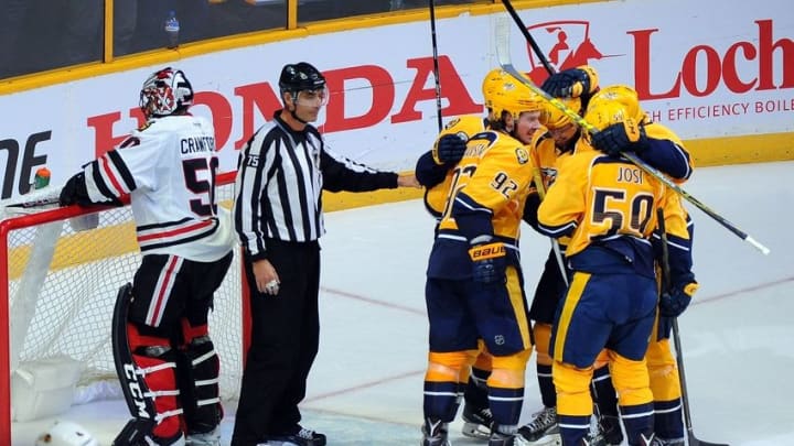 Oct 14, 2016; Nashville, TN, USA; Nashville Predators players celebrate after a goal by center Mike Fisher (12) past Chicago Blackhawks goalie Corey Crawford (50) in the second period at Bridgestone Arena. The Predators won 3-2. Mandatory Credit: Christopher Hanewinckel-USA TODAY Sports