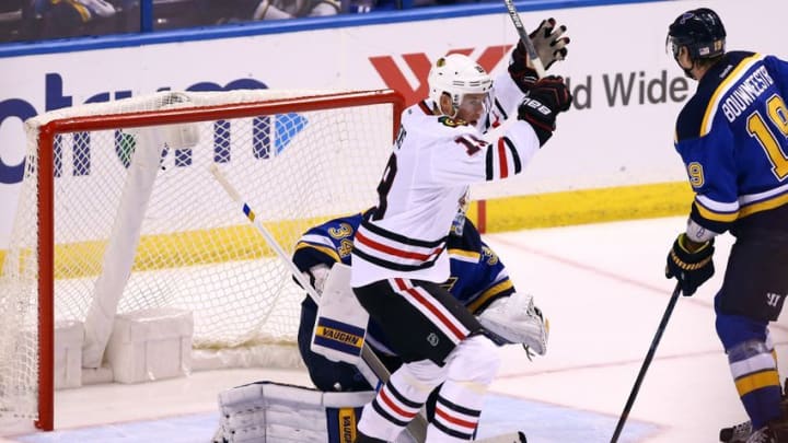 Nov 9, 2016; St. Louis, MO, USA; Chicago Blackhawks center Jonathan Toews (19) celebrates after Artemi Panarin (not pictured) scores the game-winning goal past St. Louis Blues goalie Jake Allen (34) during overtime at Scottrade Center. The Blackhawks won 2-1. Mandatory Credit: Billy Hurst-USA TODAY Sports