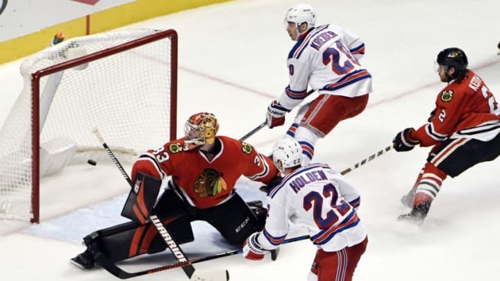 Dec 9, 2016; Chicago, IL, USA; New York Rangers defenseman Nick Holden (22) scores the game winning goal on Chicago Blackhawks goalie Scott Darling (33) during the overtime period at the United Center. The Rangers won 1-0. Mandatory Credit: David Banks-USA TODAY Sports Dec 9, 2016; Chicago, IL, USA; New York Rangers defenseman Nick Holden (22) scores the game winning goal on Chicago Blackhawks goalie Scott Darling (33) during the overtime period at the United Center. The Rangers won 1-0. Mandatory Credit: David Banks-USA TODAY Sports