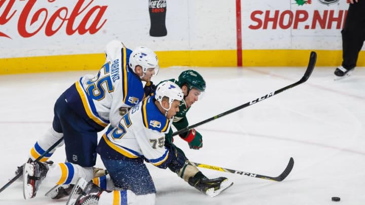 Dec 11, 2016; Saint Paul, MN, USA; St Louis Blues defenseman Colton Parayko (55) and forward Ryan Reaves (75) check Minnesota Wild forward Zach Parise (11) in the third period at Xcel Energy Center. The Minnesota Wild beat the St Louis Blues 3-1. Mandatory Credit: Brad Rempel-USA TODAY Sports